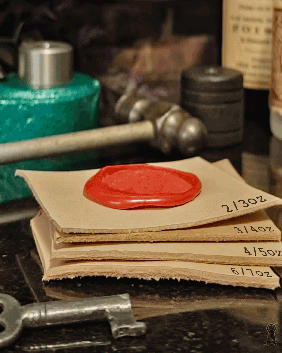 Stack of leather cuts with a red wax seal and thickness measurement markings, surrounded by vintage tools on a dark surface.