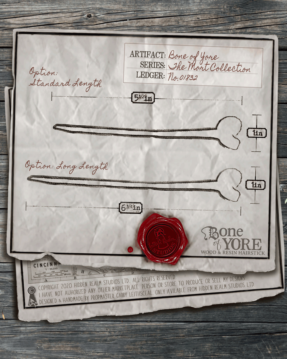 Illustration of two bones lengths with measurements on a textured paper background