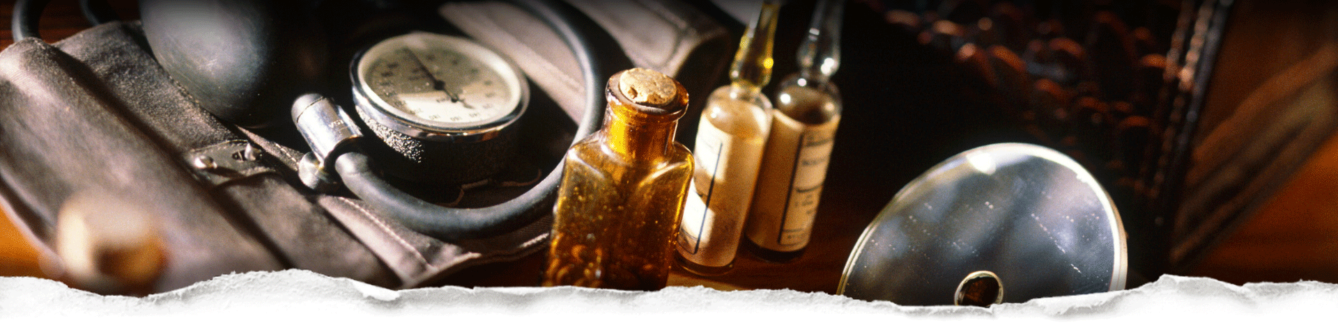 Vintage-style medical items including a leather pouch, bottles, stethoscope, and blood pressure guage behind torn paper