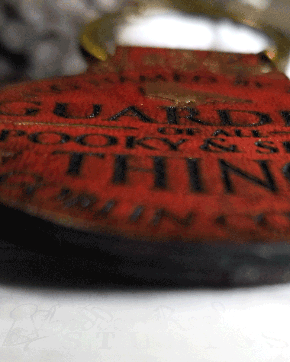 Extreme closeup of a red leather keychain design details