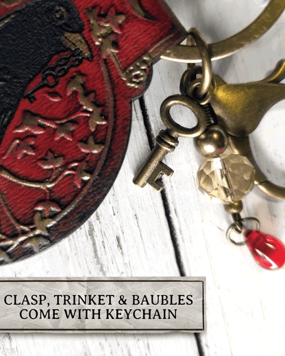 Keychain with clasp, trinket, and baubles on a white background