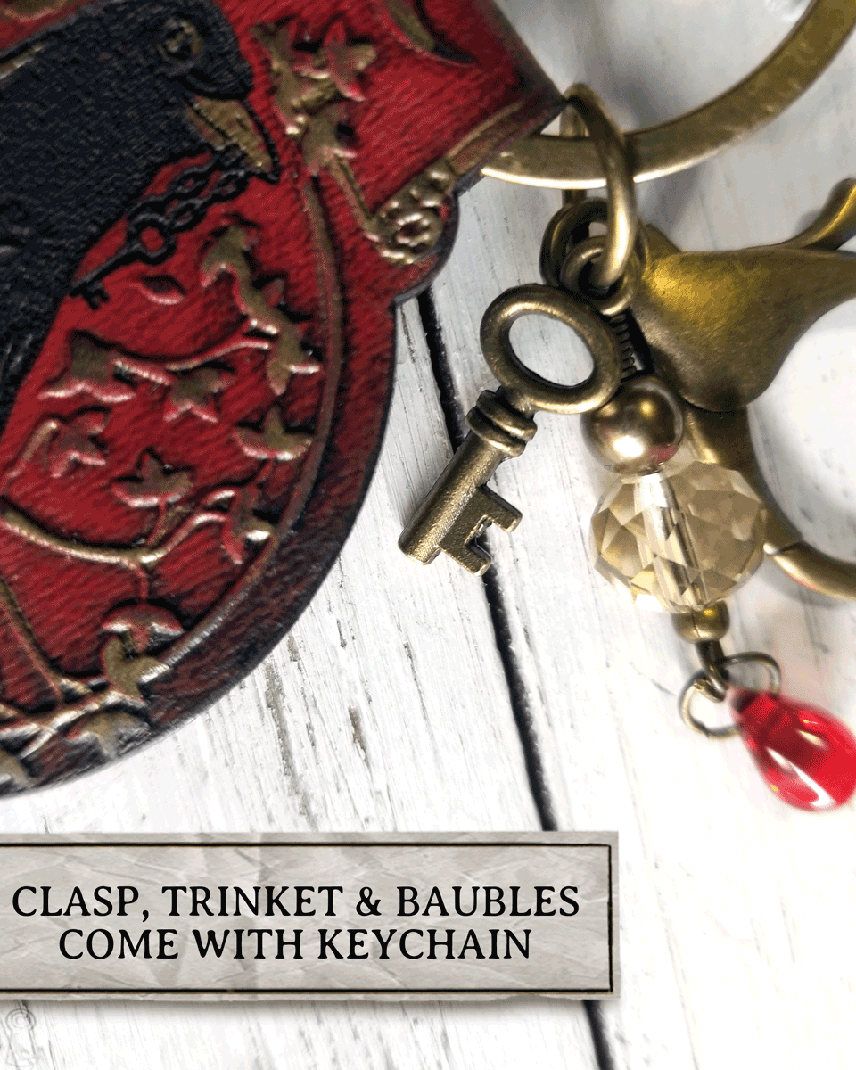 Keychain with clasp, trinket, and baubles on a white background