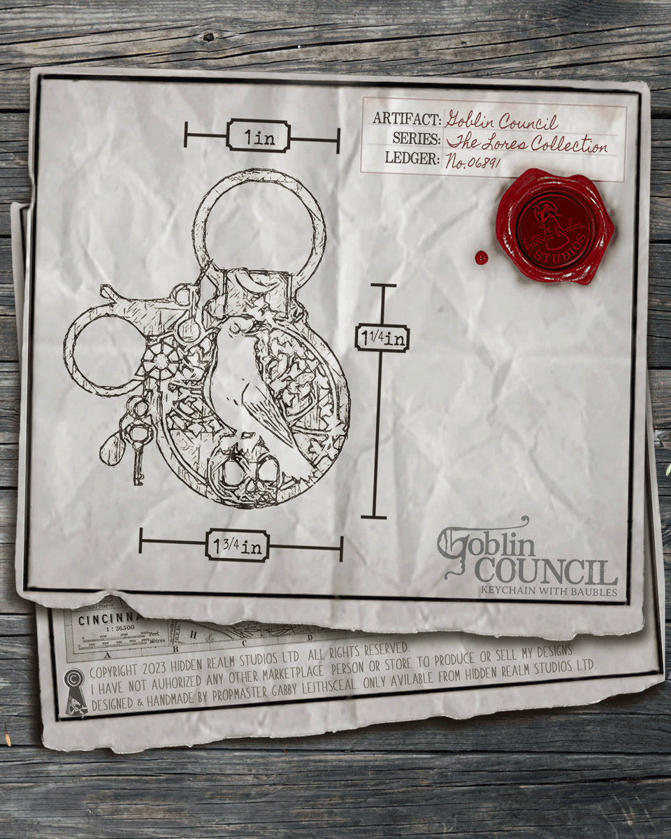 Illustration of a keychain with measurements on a textured paper background.