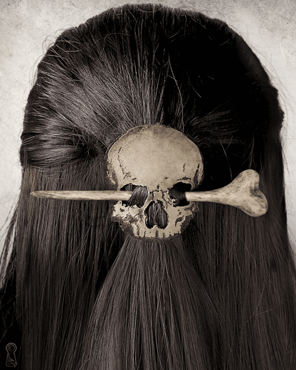 Leather skull hairpin set with wood and resin bone stick worn in hair, shown from a close angle.